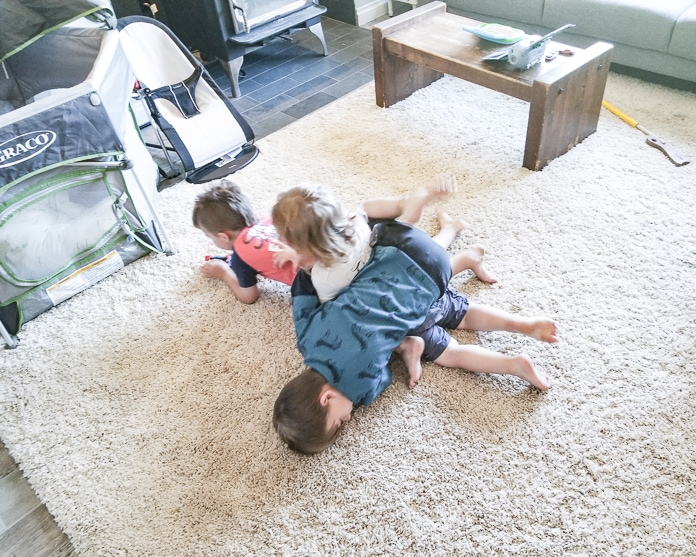 Boys wrestling in the living room