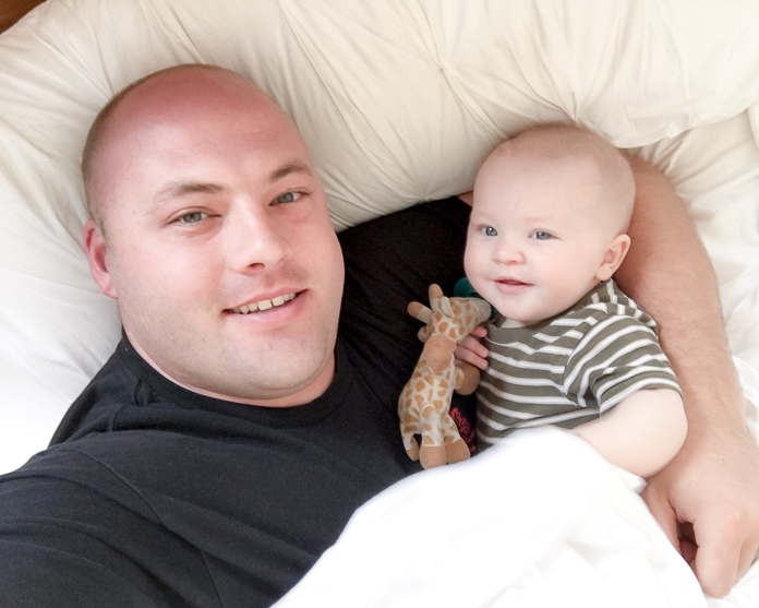 Dad and baby in bed