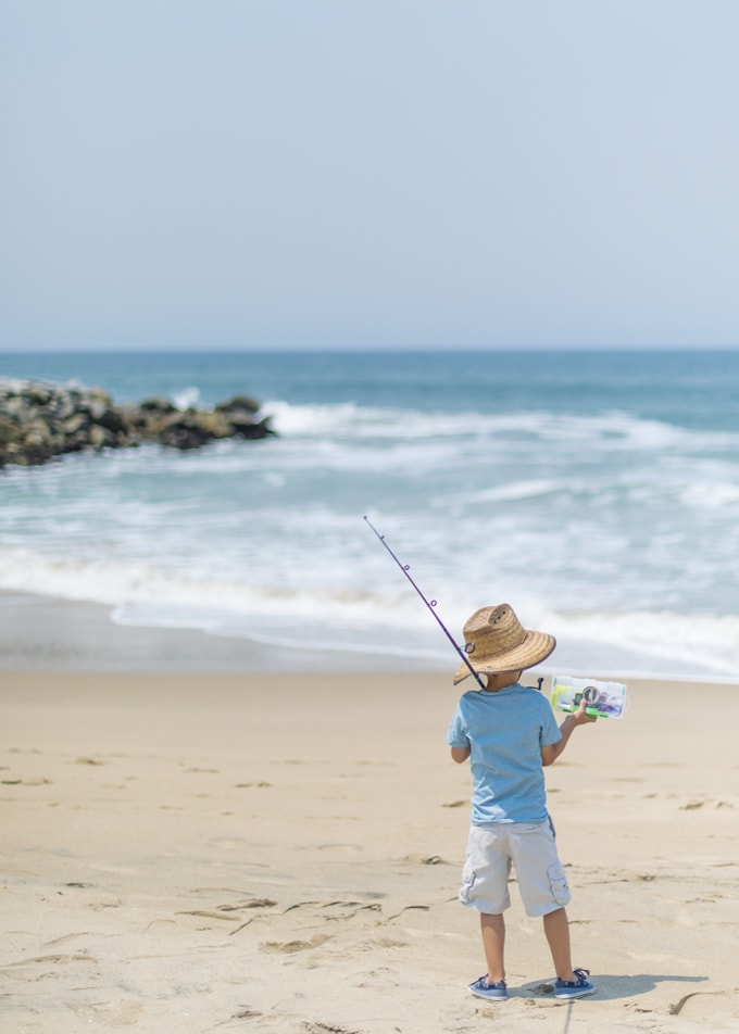 Little boy shore fishing