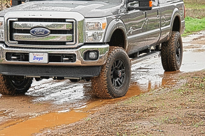 Truck driving through mud