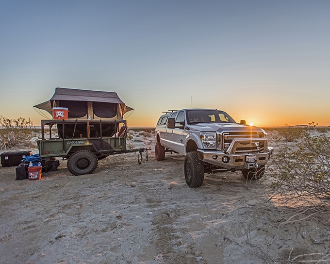 White truck with rooftop tent