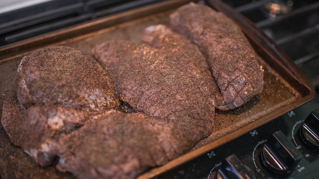Making smoked deer roast with Treager dry rub